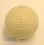 Fine and original and unused moulded mesh small guttie golf ball - unused with all the original