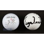 Jack Nicklaus and Tiger Woods signed golf balls - the two of the most successful golfers of all time