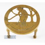 Brass Golf Figure Embossed Trivet Stand, on tree legs 15cm diameter 10cm tall