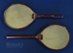 Pair of Vic small Battledore rackets - both with vellum faces, red trim, remains of the original