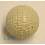 Fine and original and unused moulded mesh large guttie golf ball - with all the original white paint