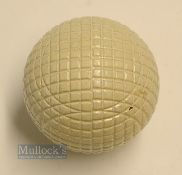 Fine and original and unused moulded mesh large guttie golf ball - with all the original white paint