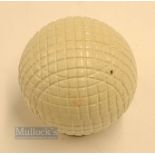 Fine and original and unused moulded mesh large guttie golf ball - with all the original white paint