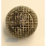 The Silver Town Moulded mesh guttie golf ball - in good round condition with minor strike marks