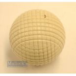 Fine and original and unused moulded mesh large guttie golf ball - with all the original white paint