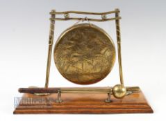 Edwardian Style Brass Golfing Dinner Gong - mounted on light stained rectangular base featuring golf