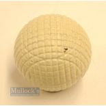 Fine and original and unused moulded mesh small guttie golf ball - with all the original white paint