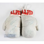 A pair of Elite Boxing gloves signed Audley Harrison, with lots of other indistinct signatures,