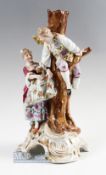 Late 19th century Sitzendorfer Candlestick depicting man and woman by a tree picking apples, bears