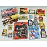 Vintage Toy Lot to include a battery-operated covered wagon, Dinky London taxi-worn box, corgi hi