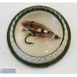 Glass paperweight with an encase gut-eyed salmon fly inside