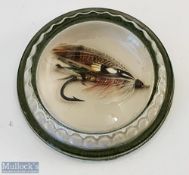Glass paperweight with an encase gut-eyed salmon fly inside