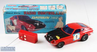 Asahi, Japan Battery Operated Radio-Controlled Datsun 240Z Boxed in red plastic with black bonnet