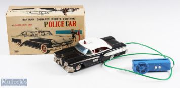 SKK, Japan Battery Operated Remote Control Tin Plate Police Car Boxed with dark blue body and