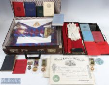 A Collection of Masonic Medals, Aprons, Sash, Gloves Booklets and paperwork, all housed within a
