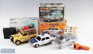 Three Assorted Remote-Controlled Car inc Hong Kong made 10" Land Rover, Wilkin Toy Police Car and