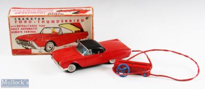 Cragstan, Japan Tinplate Ford Thunderbird with retractable top, battery operated model in red,