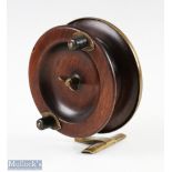 Unusual brass and wood 4 ½" side casting reel stamped 'prov pat no 35295', with spring loaded