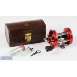 ABU Ambassadeur 6000 multiplier reel in red stamped to foot 010600, black counterbalance handle,