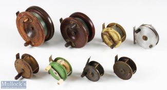 Varied selection of reels (8) includes a 4 ½" wood and brass reel with strap back, a 4" wood and