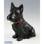 Reproduction Scottie golf advertising figure - depicting seated Scottie dog with golf ball in mouth,