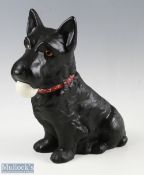 Reproduction Scottie golf advertising figure - depicting seated Scottie dog with golf ball in mouth,