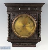 W G Whiting Manchester Barometer cased in a carved oak case with a brass engraved dial, size 37cm