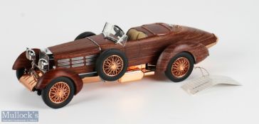 Franklin Mint Hispano Suiza 1924 Tulipwood 1:24 Model Car 121165, with a glass display case on a