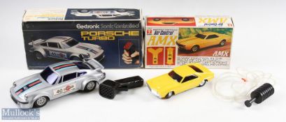 Two Boxed Remote Controlled Cars Bandai Air Control AMX battery operated car, no.7557, plus Rojo