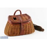 A fine leather bound wicker creel 14" x 7" x 5", leather hinge strap and buckle closure, leather