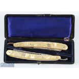 Interesting set of 2x open razors with angler holding catch inlay to handle, and gilt and etched