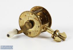 Scarce 19th century small 1 1/2" brass spike winch reel, white handle with brass wing nut, no