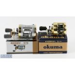 Okuma Induron ID150 No 2952 multiplier, twin handles, thumb brake, runs very well, instructions