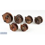 A collection of traditional mahogany and brass reels: all requiring a little attention