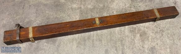 Early 20th century mahogany rod trunk with brass strap latches, brass corner brackets, small brass
