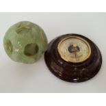 CHINESE SOAPSTONE PUZZLE BALL with carved decoration and five spheres, together with a desk