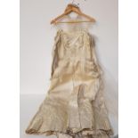 VINTAGE PERLMUTT SATIN WEDDING DRESS with brocade detail and a boned bodice, together with a veil