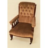 VICTORIAN ARMCHAIR with a mahogany frame and a button back above padded arms with turned supports