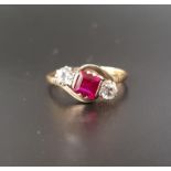 RUBY AND CLEAR GEM SET THREE STONE RING the central square cut ruby approximately 0.7cts flanked