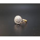 DIAMOND CLUSTER RING the central round cut diamond approximately 0.15cts surrounded by smaller