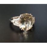 YELLOW TOURMALINE AND DIAMOND DRESS RING BY LORIQUE the large central oval cut tourmaline