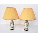 PAIR OF HEREND PORCELAIN TABLE LAMPS decorated with flowers and butterflies, both with pleated