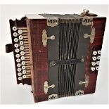 VINTAGE CONTINENTAL ACCORDIAN with a simulated rosewood body with a fret carved side panel