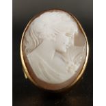 LARGE CAMEO DRESS RING the oval shell cameo depicting a female bust in profile, the cameo