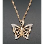 PRETTY DIAMOND SET BUTTERFLY PENDANT the pierced wings with diamond set tips, 2.3cm wide, in nine