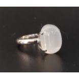 UNUSUAL MOONSTONE DRESS RING the large cabochon moonstone approximately 10cts, on eighteen carat