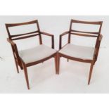PAIR OF RETRO TEAK ARMCHAIRS with slatted backs and shaped arms above grey vinyl padded seats,