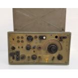 MILITARY FIELD RADIO RECEPTION SET in a green metal case with a lockable lid and side carry handles