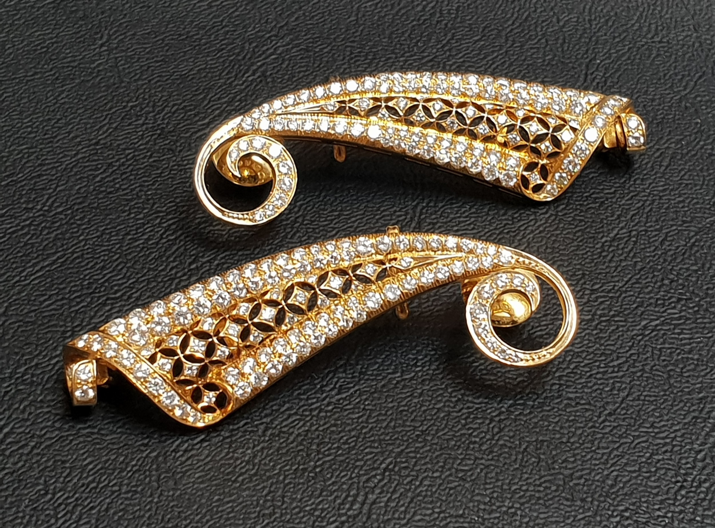 PAIR OF IMPRESSIVE DIAMOND SET EARRINGS the shaped and pierced earrings with scroll detail to the