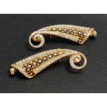 PAIR OF IMPRESSIVE DIAMOND SET EARRINGS the shaped and pierced earrings with scroll detail to the